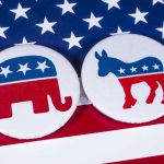 GOP Candidate SUING Opponent – Incendiary Claims! Republican elephant and Democrat donkey on American flag.