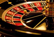 Close-up of a roulette wheel with a spinning ball