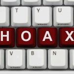 VIRAL Hoax Targets Election System – BUSTED! Close-up of a computer keyboard with the word HOAX spelled out in red keys