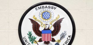 U.S. Embassy ISSUES WARNING—Americans Told: Stay Away! Seal of the United States Embassy featuring an eagle and the American flag