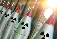 Nuclear War PANIC Grips America – New POLL Finds Line of nuclear missiles with radiation hazard signs.