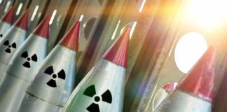 Nuclear War PANIC Grips America – New POLL Finds Line of nuclear missiles with radiation hazard signs.