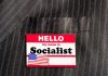 ANOTHER Socialist Mayor Elected – Wins By 97 Votes! Hello my name is Socialist name tag on suit.