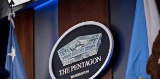 Pentagon TARGETS Dem Senator – Court-Martial LOOMING The Pentagon emblem between two flags.