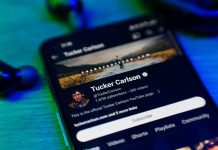 Tucker REFUSES Apology — Media Elites Furious Smartphone displaying a YouTube channel profile page.