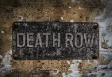 Death Row EXONERATION – Victims Family Demands Release Weathered Death Row sign on aged concrete wall