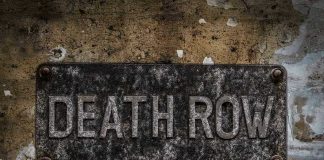 Death Row EXONERATION – Victims Family Demands Release Weathered Death Row sign on aged concrete wall