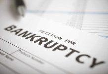 Hollywood Film Studio BANKRUPT – Files Chapter 11! Petition for bankruptcy document with pen.