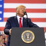 Trump ESCALATES Oil War: Unseen Move Exposed Man speaks at podium with U.S. flag background.
