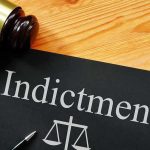 INDICTED Democrat Tied To Explosive Fraud Cash Grab Gavel next to indictment document on table