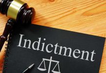 INDICTED Democrat Tied To Explosive Fraud Cash Grab Gavel next to indictment document on table