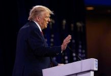 Trump SIEZES Venezuela Tanker – Sparks High-Seas SHOWDOWN! Person speaking at a podium with hand raised