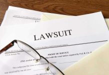 DISGUSTING Lawsuit Rocks Major Chain – Customer Bit Into What?! Documents labeled Lawsuit with glasses on top.