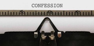 Typewriter typing the word confession on paper