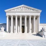 SCOTUS Takes Case – Most Unconstitutional EVER! The Supreme Court building featuring marble columns and a clear blue sky