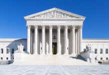 SCOTUS Takes Case – Most Unconstitutional EVER! The Supreme Court building featuring marble columns and a clear blue sky