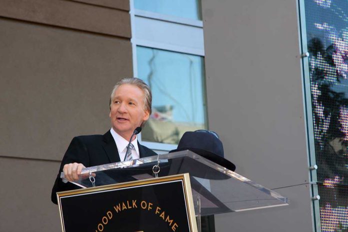 shutterstock_61212673.jpg A man in formal attire speaking at a podium during a Hollywood Walk of Fame ceremony