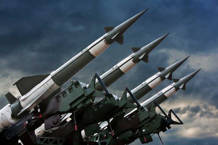 shutterstock_71240899.jpg Array of missile launchers positioned against a dramatic sky