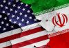 Trump Sends Tehran DIRECT Warning – “We Stand Ready” Cracked American and Iranian flags on a wall.