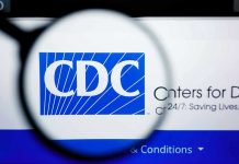 CDC SLASHES Childhood Vaccines – Medical Establishment STUNNED CDC logo magnified on a screen.