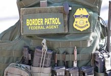 Hotel MALICIOUSLY BANS ICE Agents, Then THIS HAPPENED Border Patrol vest with gear and communication equipment.