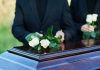 Reagan Son Dead at 80 – Heartbreaking Cause Identified People placing white roses on a casket.