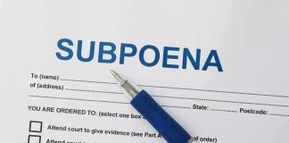 Trump SUBPOENAS Top MN Dems – Mob Incitement Probe A subpoena document with a blue pen resting on it