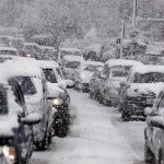 Storms DESTROYS U.S – 10,000 Flights Cancelled, Millions STRANDED! Traffic jam with cars covered in heavy snow during a snowstorm