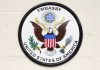 US Embassy FACES Angers After Removing Flags Seal of the United States Embassy featuring an eagle and the American flag