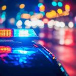 Cops KILL Woman After House Call Turns Deadly Police car with flashing lights at night.