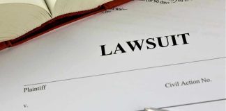 Meghan McCain Threatens Alex Jones With Lawsuit After Disgusting Smear Lawsuit document with a pen and book.