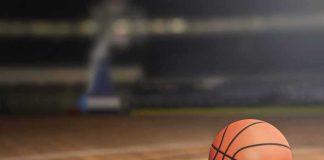A basketball on a wooden court