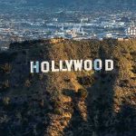 Shocking Defamation Suit: Cops vs. Hollywood Titans The Hollywood sign on a hillside.