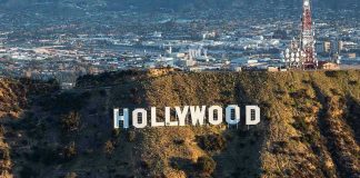 Shocking Defamation Suit: Cops vs. Hollywood Titans The Hollywood sign on a hillside.