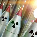 Georgia’s Hidden Danger—Nuclear Bomb Beneath! Line of nuclear missiles with radiation hazard signs.
