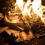 Iran Ceasefire Chaos: War Costs Explode Stacks of hundred dollar bills burning in flames.