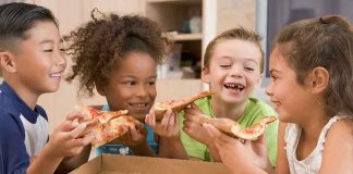 Junk Food’s Lasting Brain Impact: Shocking Findings Children happily eating pizza together.
