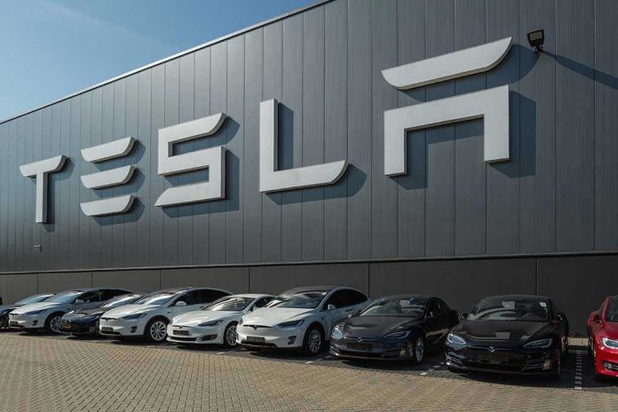Tesla facility with parked cars in front.