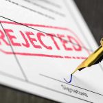 eBay Rejects GameStop’s $56B Gambit—Shocking Rebuff! Rejected stamp on a document with pen.