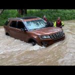 3 rescued after SUV gets stranded in southeastern Indiana floodwaters