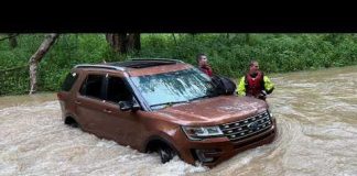 SUV Submerged! Heart-Stopping Rescue Caught on Video 3 rescued after SUV gets stranded in southeastern Indiana floodwaters