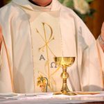 Pope Preached Zero Tolerance—Then THIS Surfaced A priest holding a golden chalice during a religious ceremony