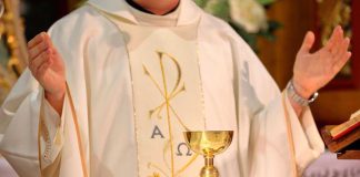 Pope Preached Zero Tolerance—Then THIS Surfaced A priest holding a golden chalice during a religious ceremony