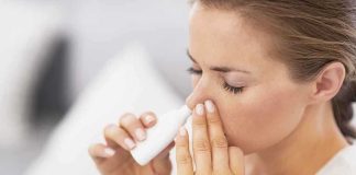 Brain Aging Reversed With Nasal Spray Woman applying nasal spray for relief