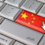 SHOCKING Betrayal: California Mayor’s Secret Chinese Ties Close-up of a computer keyboards enter key featuring the Chinese flag