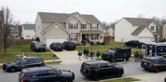 FBI agents conducting an operation in a suburban neighborhood