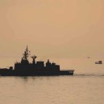 naval ship silhouette at sea during sunset