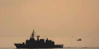 War Powers Sidestepped — Democracy on Mute naval ship silhouette at sea during sunset