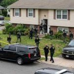 Fresh Evidence? Owens Reopens the Kirk Mystery Law enforcement officers conducting a raid in a residential neighborhood