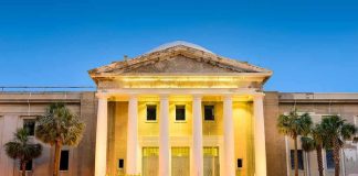 Paris Shock: Epstein Tie Dies Mid-Inquiry Supreme Court building with illuminated columns at dusk